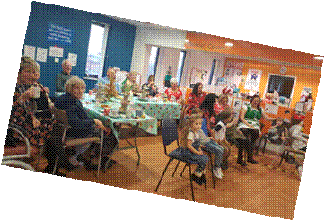 A group of people sat around the tables